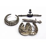A ROYAL NAVY SWEETHEART BAR BROOCH stamped 'Sterling Silver'; a German paste set crescent brooch;