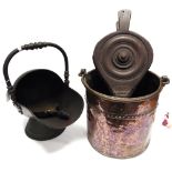 A VICTORIAN COPPER HELMET SHAPED COAL SCUTTLE with an associated shovel, a circular copper coal