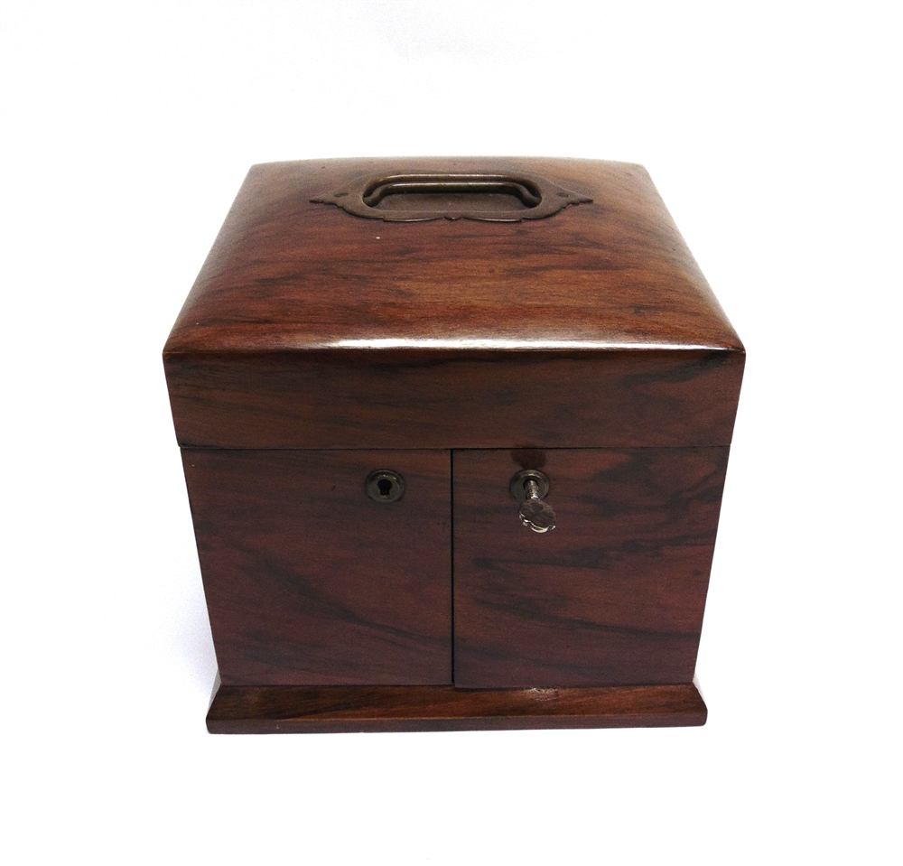 A VICTORIAN GENTLEMANS WALNUT TRAVELLING TOILETRY BOX the slightly domed top with inset carrying