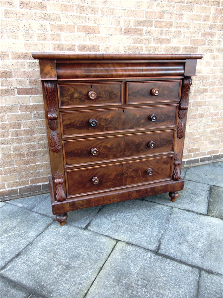 A LARGE VICTORIAN FIGURED MAHOGANY CHEST OF DRAWERS with ogee drawer above two short and three