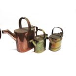 THREE VICTORIAN COPPER AND BRASS WATERING CANS the largest 39cm high