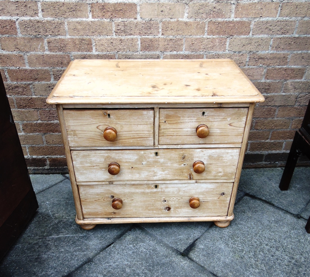A SMALL PINE CHEST OF TWO SHORT AND TWO LONG DRAWERS on bun feet, 84cm wide 51cm deep 73cm high