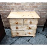 A SMALL PINE CHEST OF TWO SHORT AND TWO LONG DRAWERS on bun feet, 84cm wide 51cm deep 73cm high