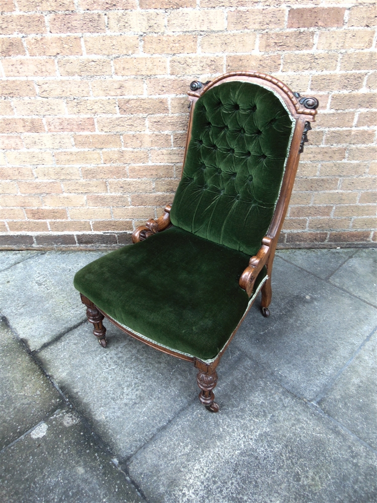 A VICTORIAN BUTTON UPHOLSTERED NURSING CHAIR with carved oak frame, 62cm wide 68cm deep 94cm high