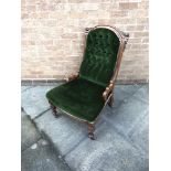 A VICTORIAN BUTTON UPHOLSTERED NURSING CHAIR with carved oak frame, 62cm wide 68cm deep 94cm high