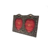 AN EDWARDIAN SILVR DOUBLE HEART PHOTOPGRAPH FRAME London 1902, the heart shaped apertures,