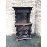 A VICTORIAN CARVED OAK SIDE CABINET the upper section with moulded frieze above female caryatid