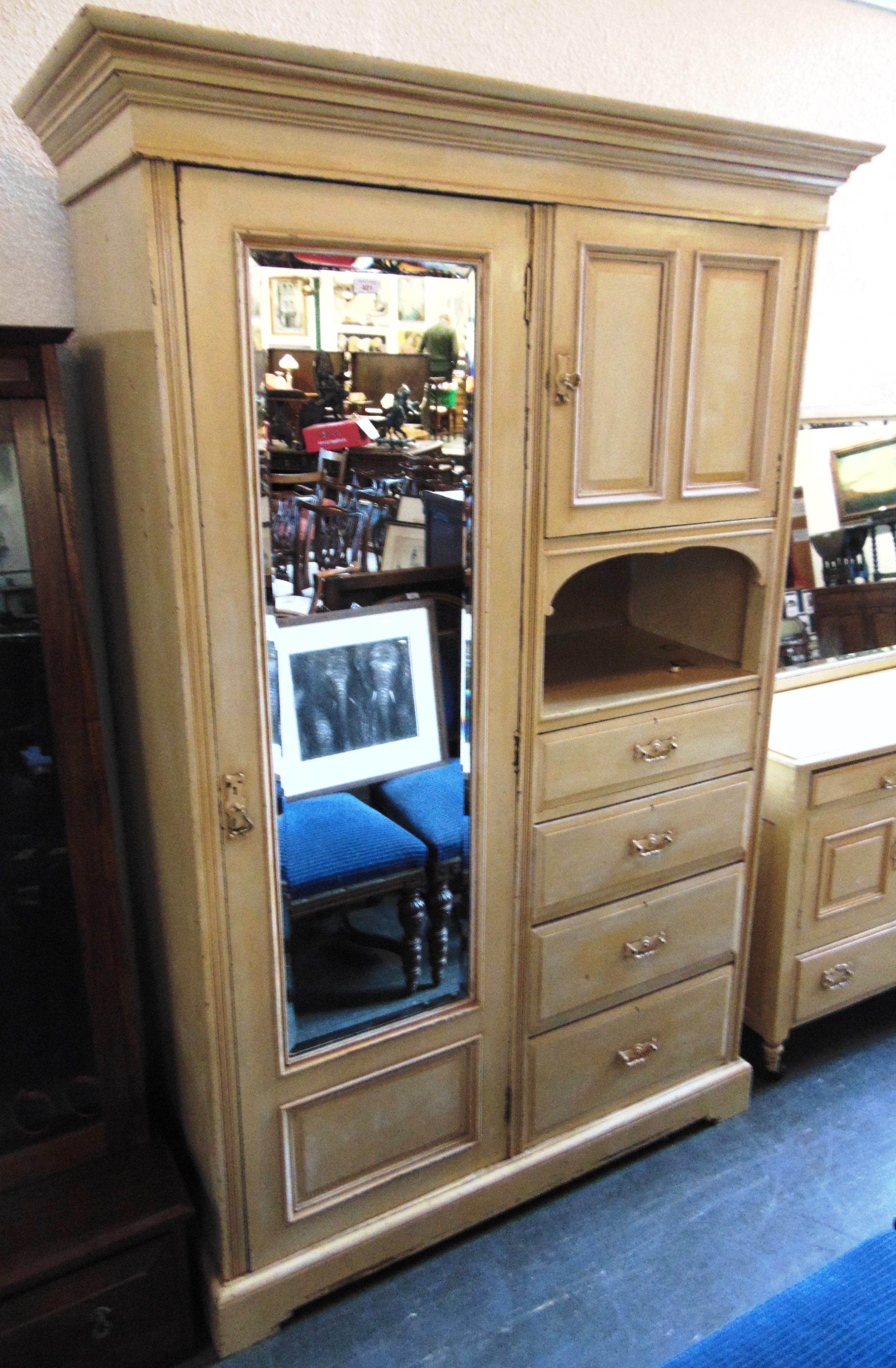 AN EDWARDIAN PAINTED ASH FITTED WARDROBE with mirrored door opening to hanging space above deep