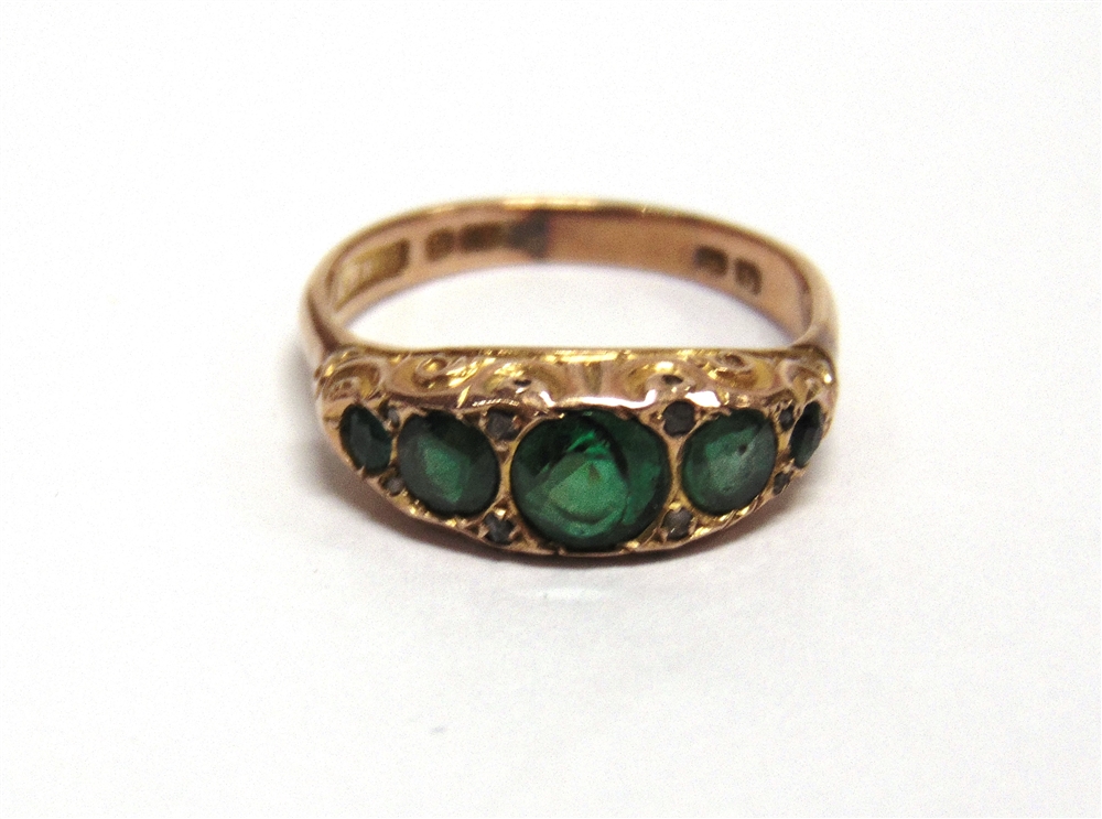 A 9 CARAT GOLD ETERNITY RING a 9 carat gold wedding ring; another, a fire stone green doublet 9 - Image 2 of 2