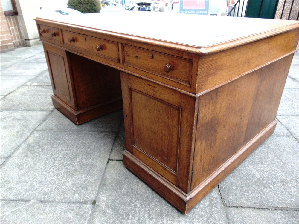 A VICTORIAN OAK PARTNERS DESK the rectangular top with three frieze drawers to each side, on - Image 6 of 9