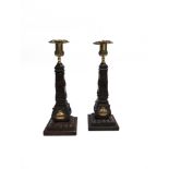 A PAIR OF MASONIC CARVED WOODEN SOUVENIR CANDLESTICKS with cast brass sockets, the base of each stem