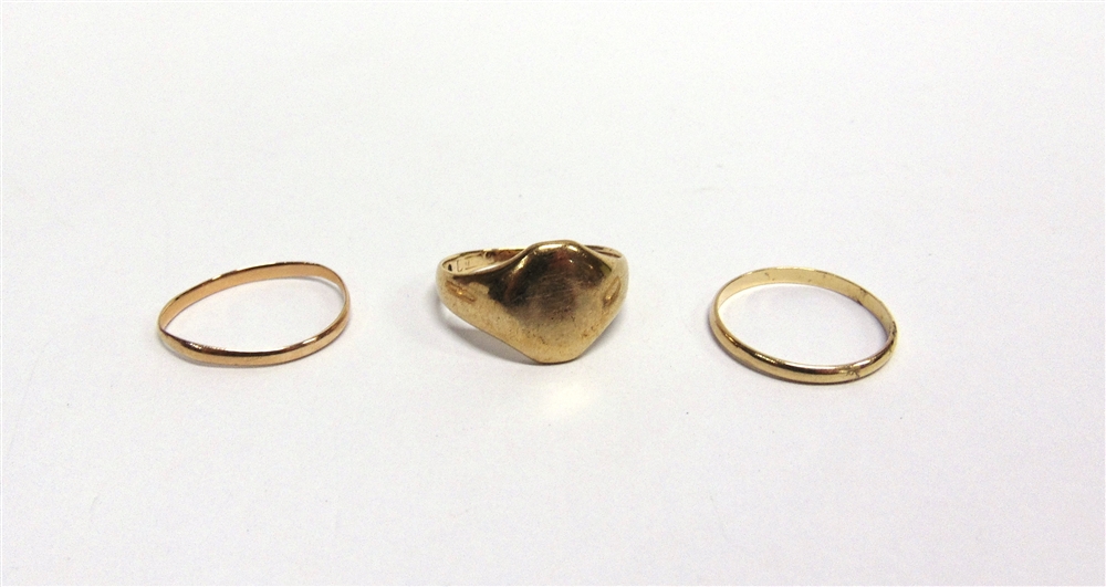 A SIGNET RING with worn marks; and two unmarked wedding rings, 7.1g gross