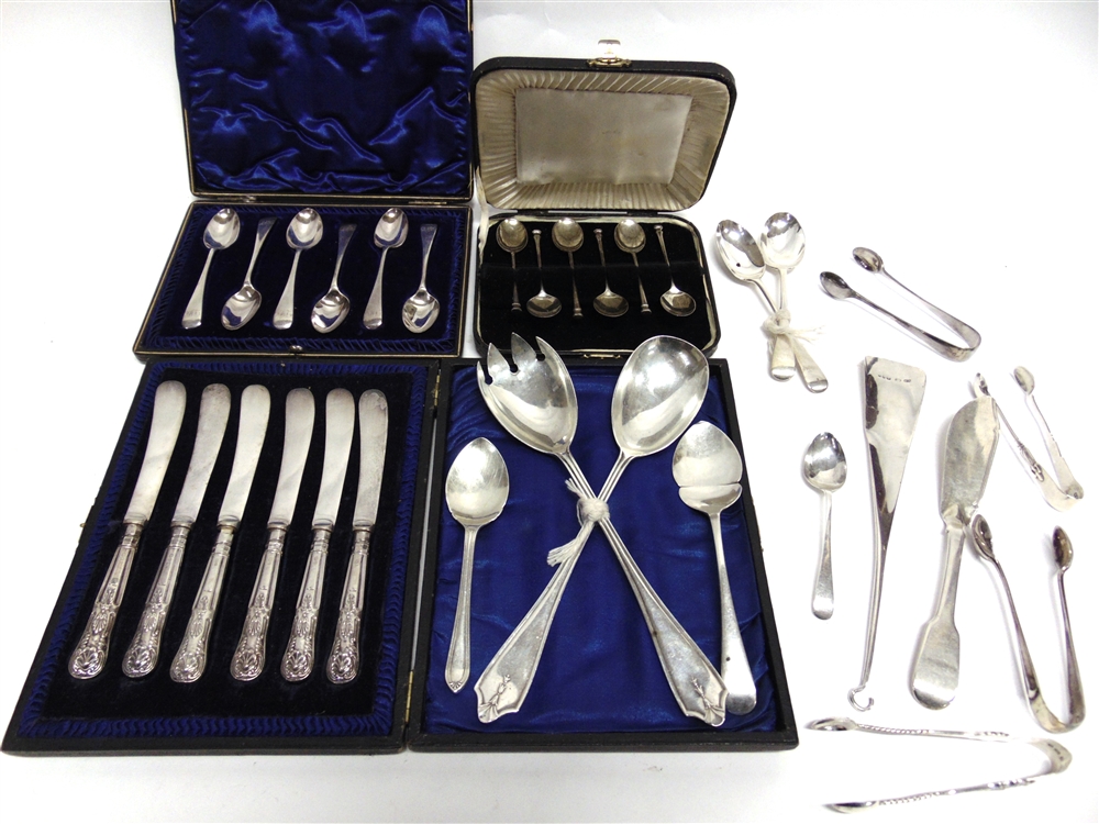 A COLLECTION OF SILVER FLATWARE including a pair of salad servers; a cased set of six coffee spoons;