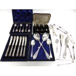 A COLLECTION OF SILVER FLATWARE including a pair of salad servers; a cased set of six coffee spoons;