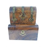 A VICTORIAN FIGURED WALNUT DOMED TOP TEA CADDY with gilt brass fittings in the Gothic style, 22cm