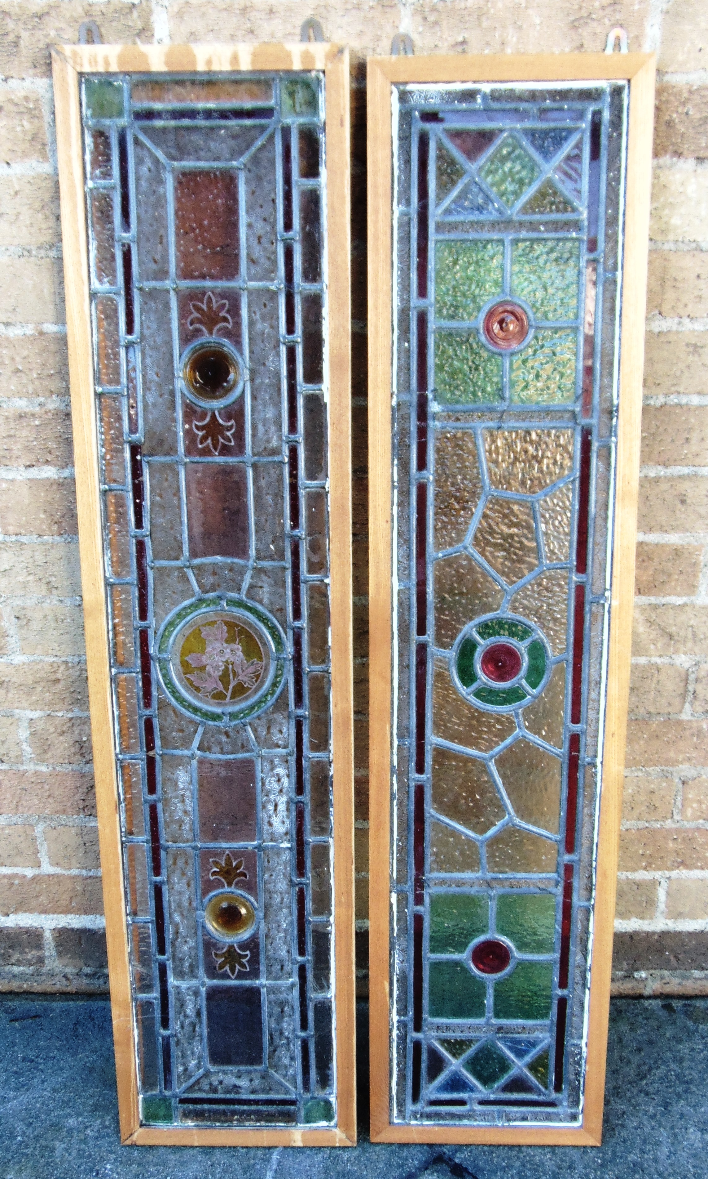 A PAIR OF LEADED AND STAINED GLASS PANELS approx 27cm x 118cm including frames