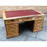 A VICTORIAN OAK PARTNERS DESK the rectangular top with three frieze drawers to each side, on