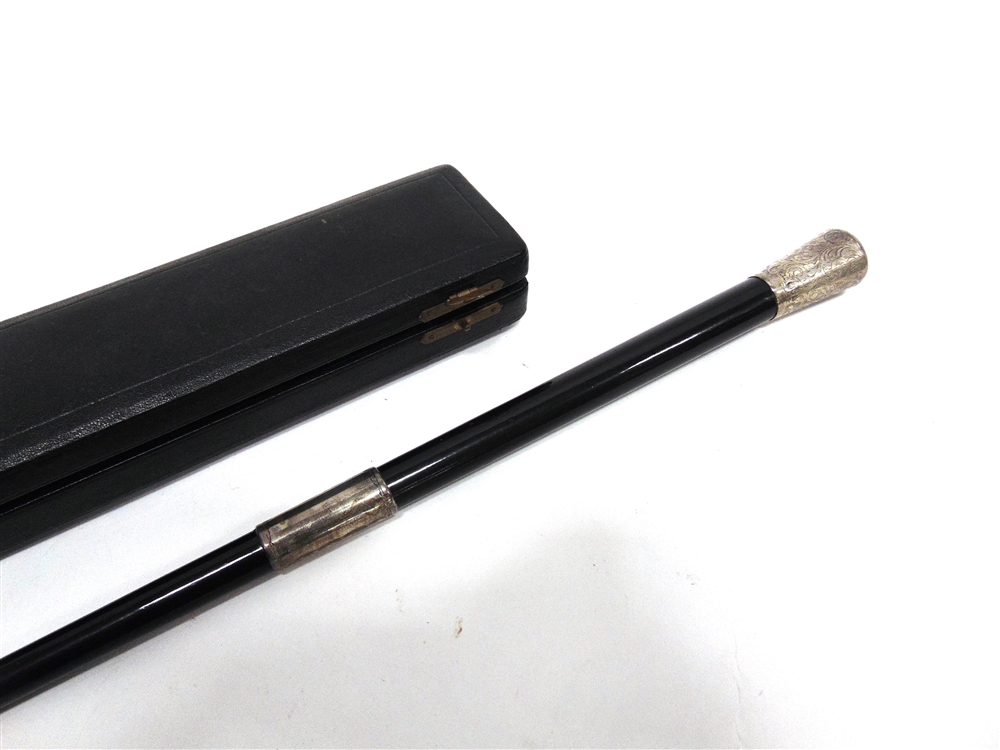 A TWO PIECE EBONY AND SILVER MOUNTED BATON in a presentation case; with another similar baton - Image 2 of 5
