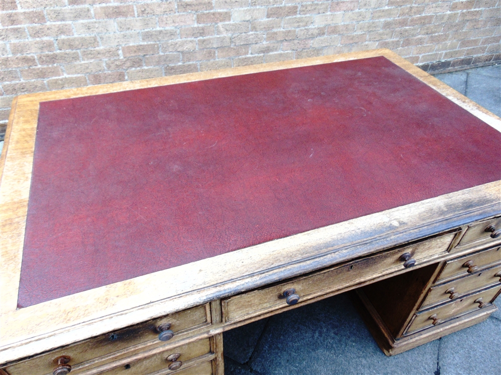 A VICTORIAN OAK PARTNERS DESK the rectangular top with three frieze drawers to each side, on - Image 9 of 9