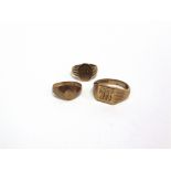 A 9 CARAT GOLD SIGNET RING monogrammed; another; and another, unmarked; 11g gross