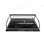 A VICTORIAN EBONISED TABLE TOP DISPLAY CABINET with curved glass top, removable velvet lined tray