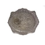 A LARGE AND ORNATE INDIAN METALWARE TRAY heavily chased with flora, similarly decorated pierced