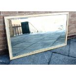 A LARGE BEVEL EDGE WALL MIRROR with painted frame, 75cm x 125cm