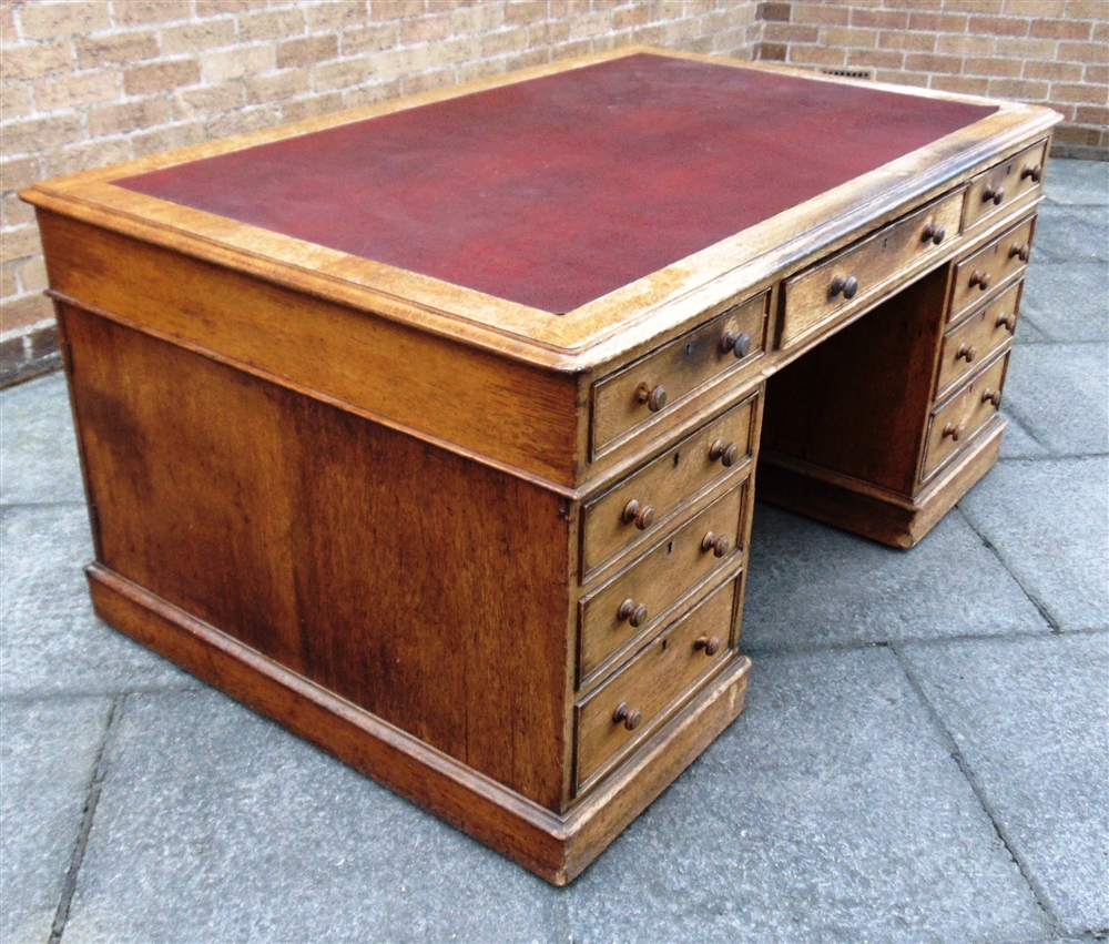 A VICTORIAN OAK PARTNERS DESK the rectangular top with three frieze drawers to each side, on - Image 2 of 9