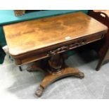 A WILLIAM IV ROSEWOOD CARD TABLE the frieze with carved decoration, on octagonal inverted baluster