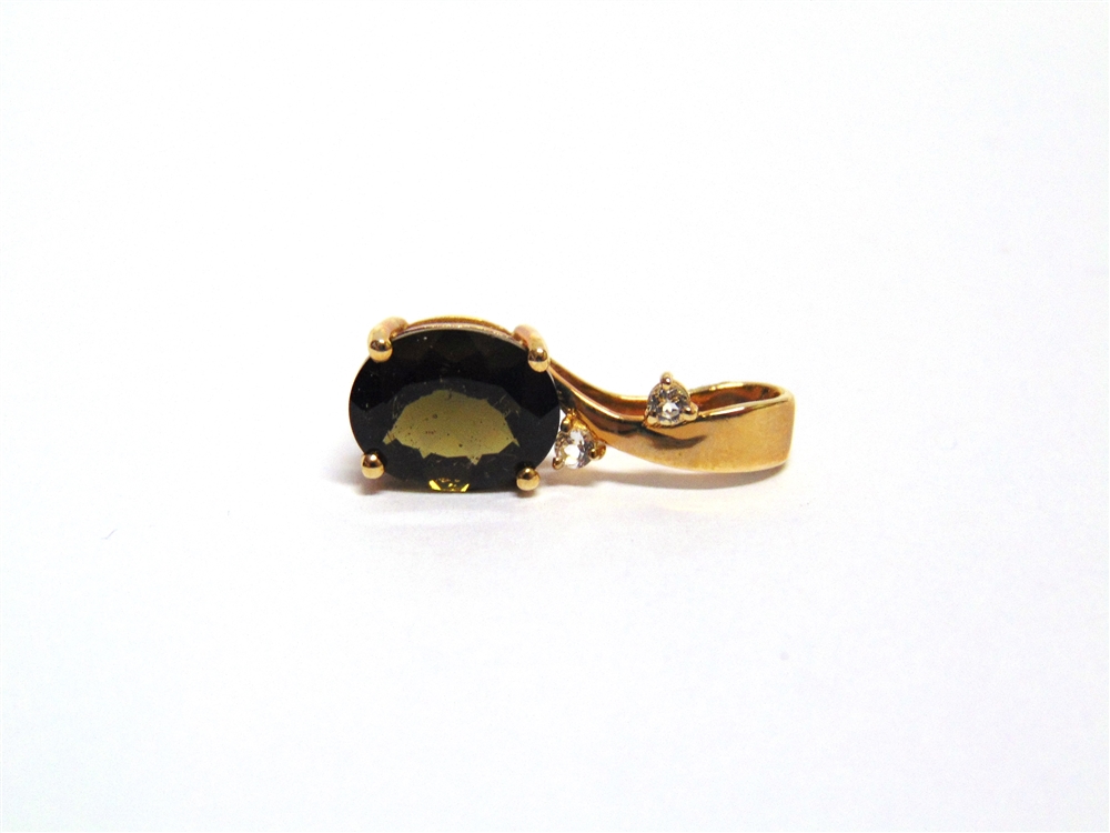 A 9 CARAT GOLD MOLDAVITE PENDANT with two synthetics to the bale, 1.5g gross