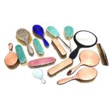 A COLLECTION OF THREE SILVER ENAMEL HAIR BRUSHES four similar clothes brushes; a small purse mirror;