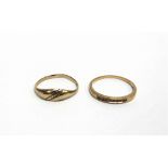 A 9 CARAT GOLD DIAMOND HALF HOOP RING channel set with nine brilliant cuts, totalling