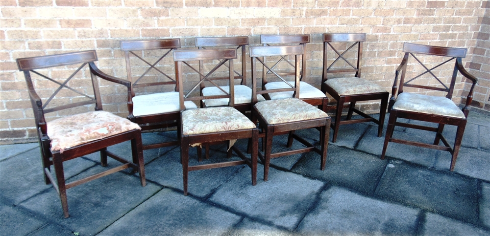 A SET OF EIGHT EARLY 19TH CENTURY DINING CHAIRS including a pair of carvers, the back rails with