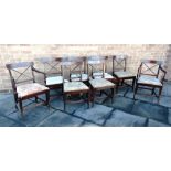 A SET OF EIGHT EARLY 19TH CENTURY DINING CHAIRS including a pair of carvers, the back rails with