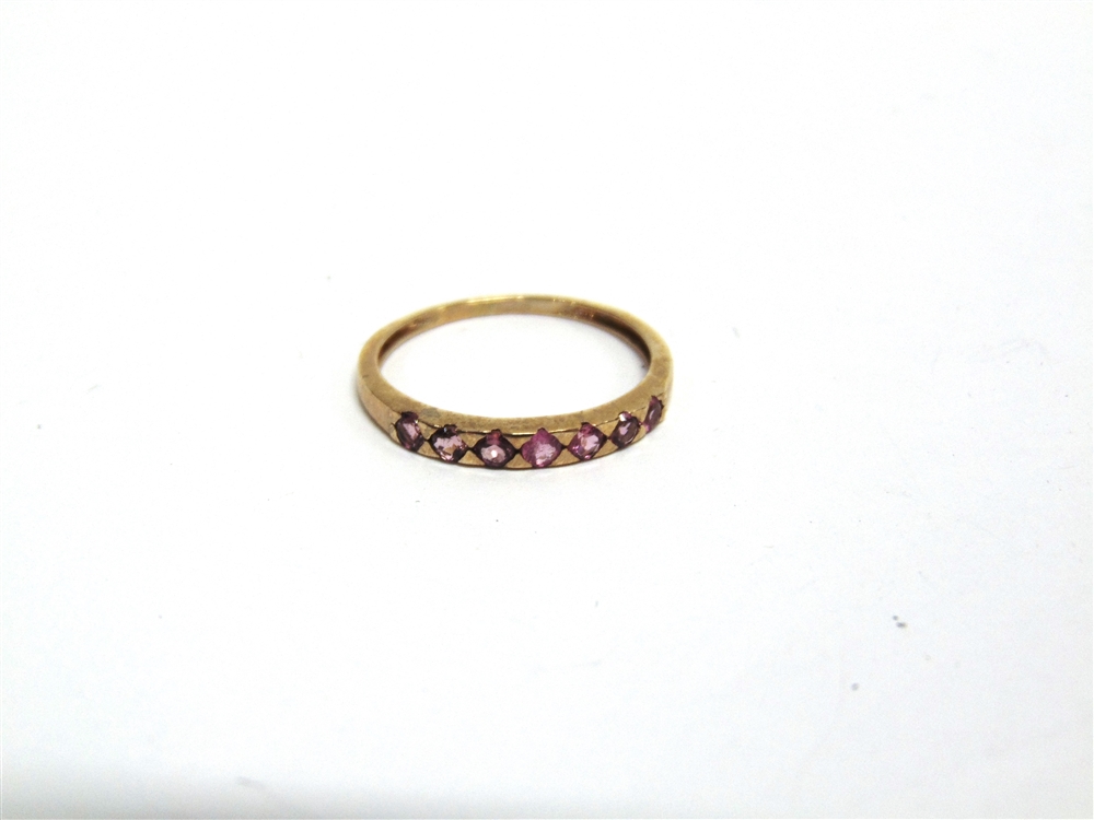 A SEVEN STONE RUBELLITE 9 CARAT GOLD HALF HOOP RING finger size S, 1.5g gross - Image 3 of 3