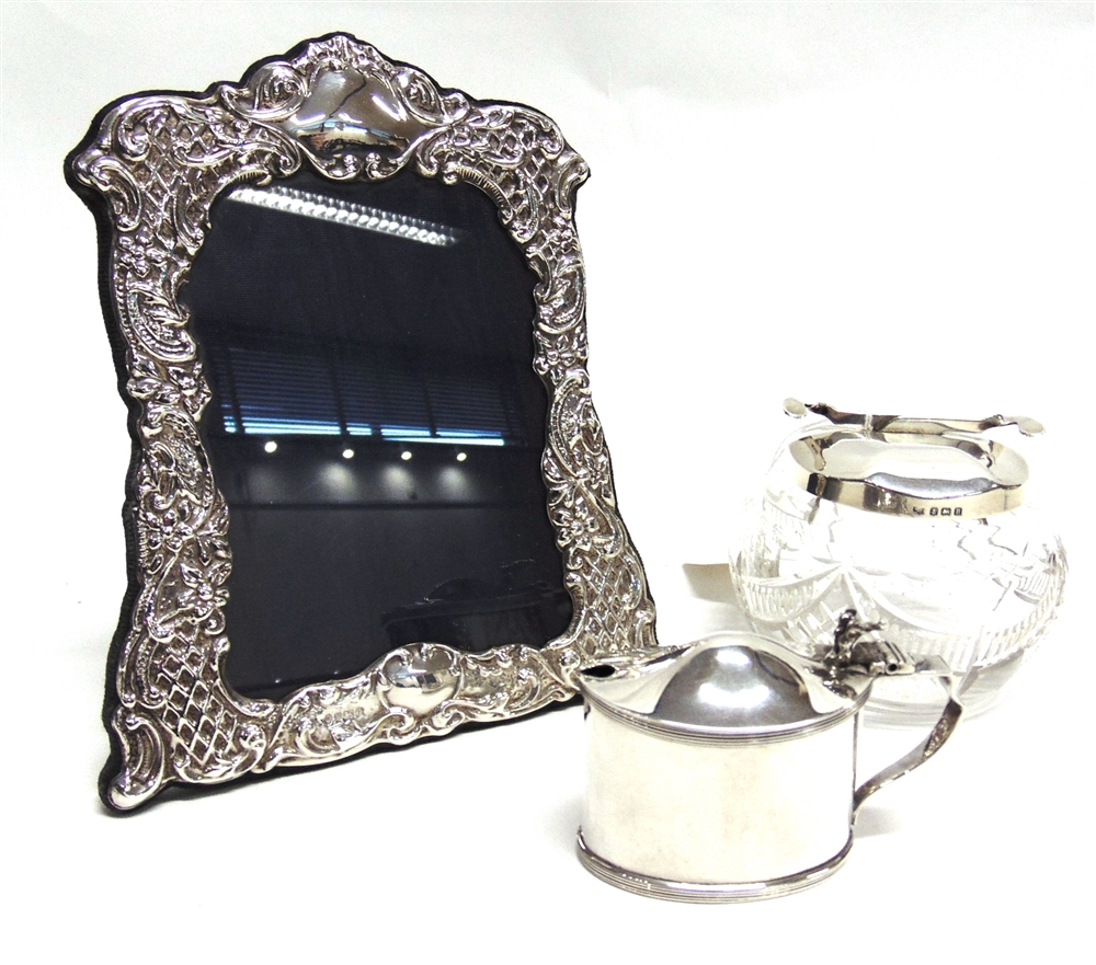 A MODERN SILVER PHOTOGRAPH FRAME by Carr, Sheffield 1993; a silver mustard pot, with glass liner;