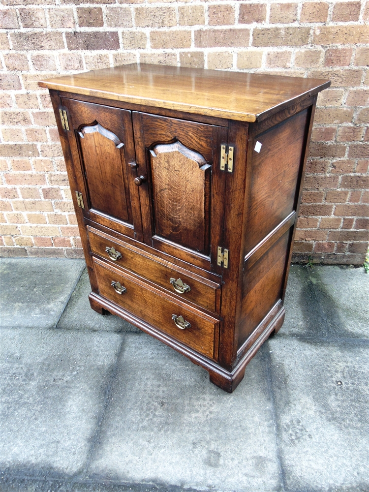 AN OAK REPRODUCTION SIDE CABINET in the manner of Tithchmarsh & Goodwin, fitted with pair of doors - Image 2 of 2