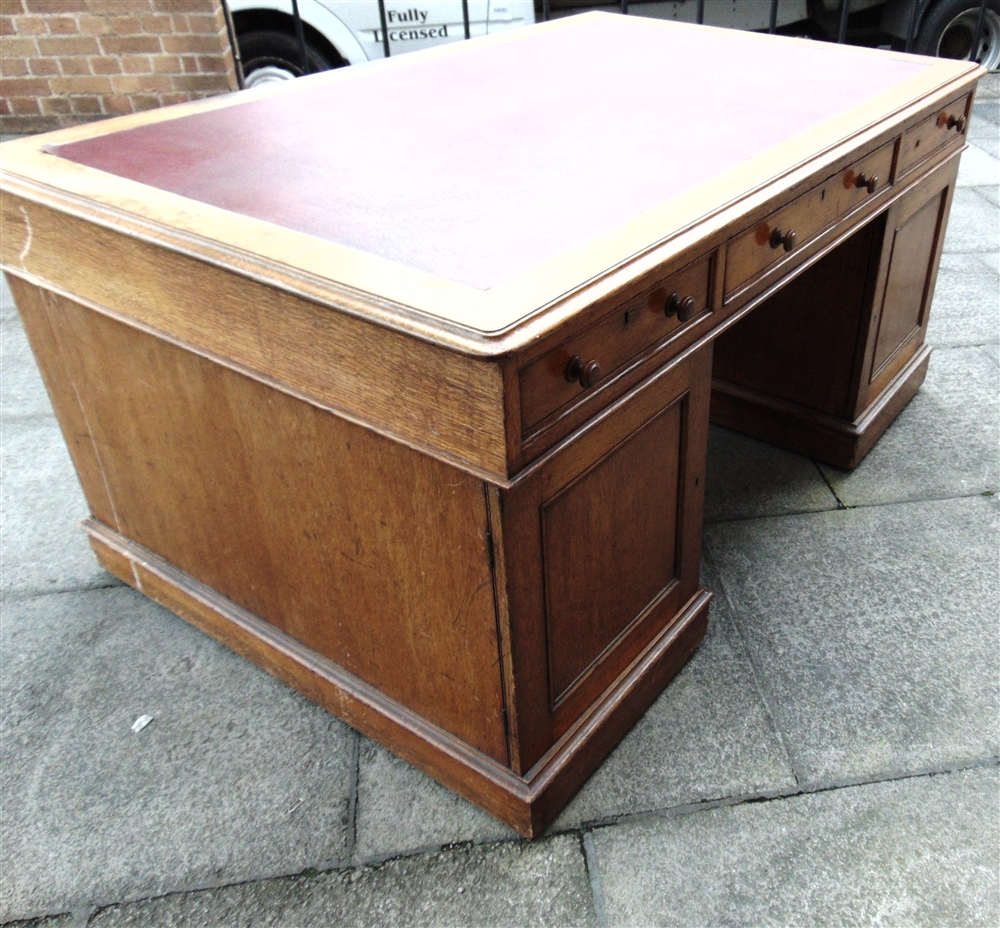 A VICTORIAN OAK PARTNERS DESK the rectangular top with three frieze drawers to each side, on - Image 5 of 9