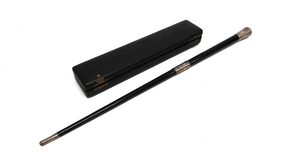 A TWO PIECE EBONY AND SILVER MOUNTED BATON in a presentation case; with another similar baton