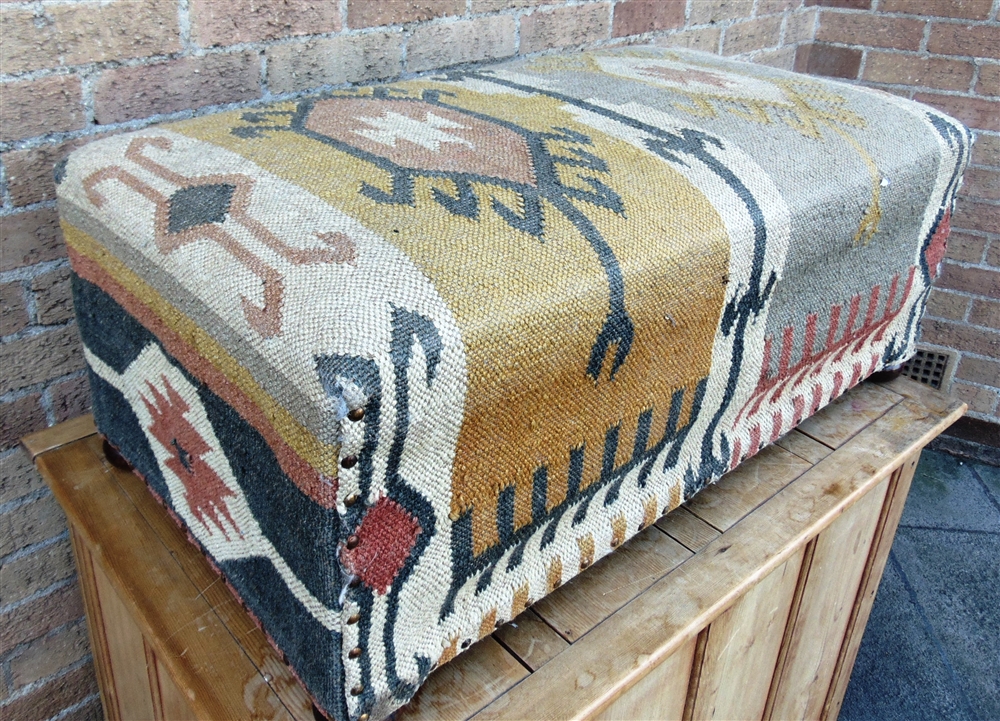 A LARGE KILIM COVERED FOOT STOOL on bun feet, 90cm x 50cm, 36cm high - Image 2 of 2