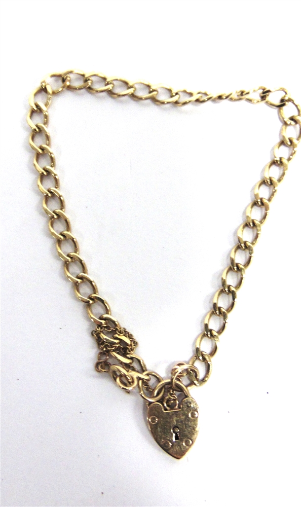 A BRACELET OF FILED CURB LINKS to a 9 carat gold padlock clasp, 6.3g gross