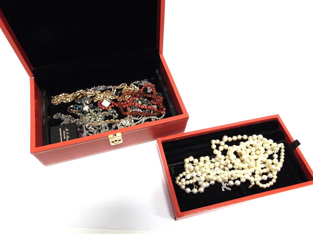 A SMALL COLLECTION OF COSTUME JEWELLERY housed in a red jewellery case