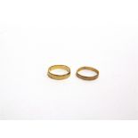 A 22 CARAT GOLD WEDDING RING and another; 3.8g gross