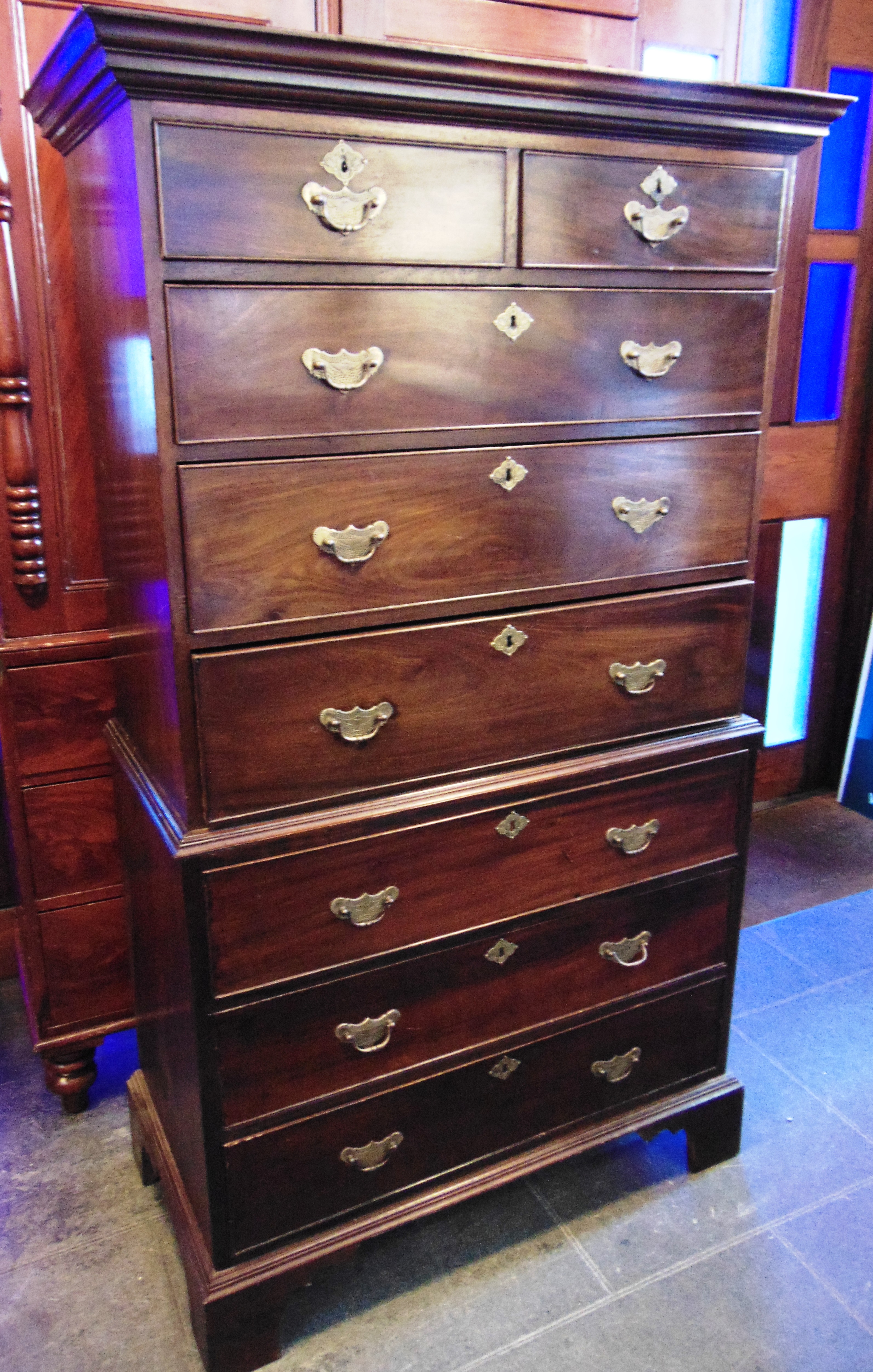 A MAHOGANY CHEST ON CHEST the upper section with moulded frieze above two short and three long