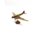 A CAST BRASS MODEL OF A DOUGLAS C-47 SKYTRAIN / DAKOTA AIRCRAFT circa 1940s, wingspan 38.5cm.