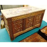 AN OAK COFFER with ornately carved swag decoration, 108cm wide 52cm deep 63cm high