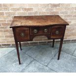 A SMALL EARLY 19TH CENTURY MAHOGANY SIDEBOARD with serpentine front top above three drawers, on