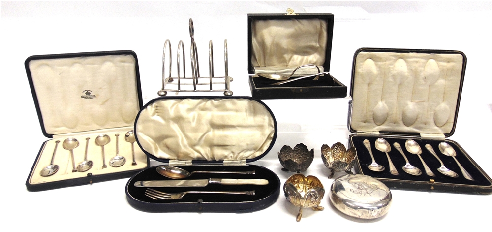 A CASED SET OF SILVER TEASPOONS another similar; a cased silver spoon and pusher set; a cased silver