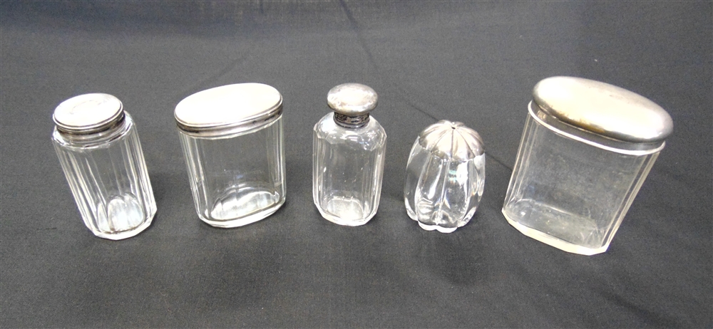 A LATE VICTORIAN SILVER MOUNTED GLASS SALT POT three silver mounted glass toilet bottles; and a