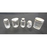 A LATE VICTORIAN SILVER MOUNTED GLASS SALT POT three silver mounted glass toilet bottles; and a